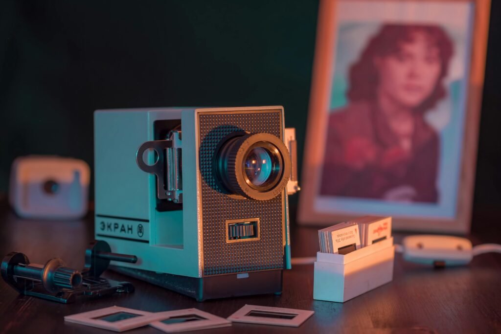 pexels-photo-3067112-3067112 A nostalgic close-up of a vintage slide projector setup with a photo frame, evoking retro vibes.